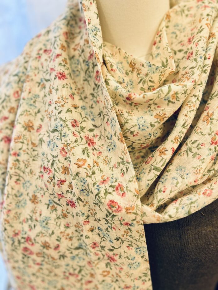 A soft and lovely addition to a warm sweater or summer dress. Beautiful Print. Cotton with Lace Trim