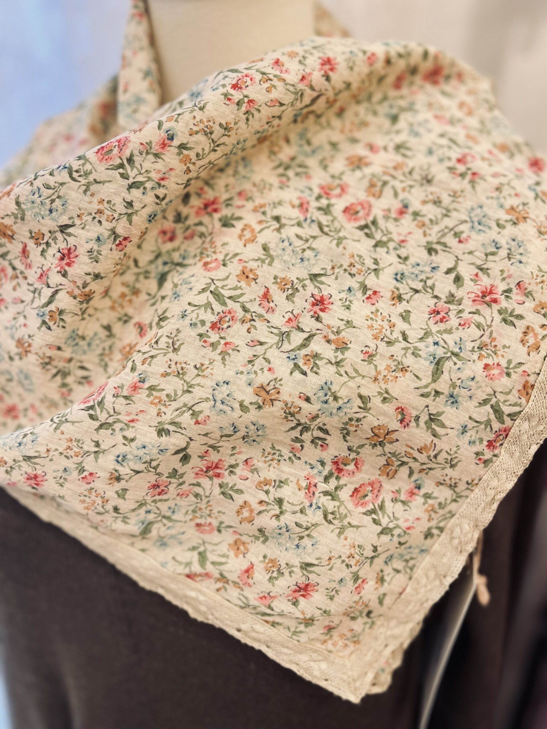 A soft and lovely addition to a warm sweater or summer dress. Beautiful Print. Cotton with Lace Trim